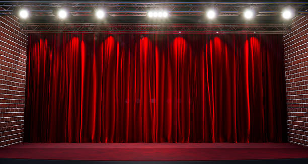 istock Closed red curtain of stage, red stage curtain background with spotlight 2242652049