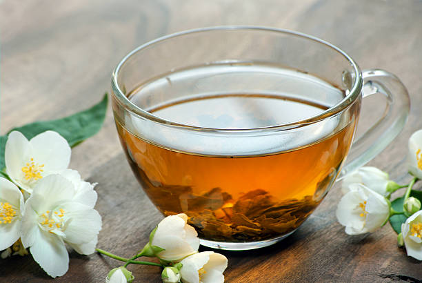 istock a cup of green tea with jasmine. close up 2242652077