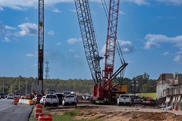 istock highway construction site with large crane and pile driven into ground by vibrating hydraulic hammer 2242654046