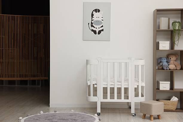 istock Baby's room with crib and toys. Interior design 2242655443