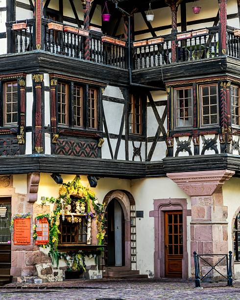 Kaysersberg, France – August 19, 2025: Charming Kaysersberg village with medieval architecture and colorful facades at sunset.
