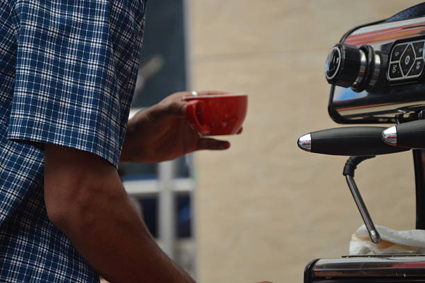 istock Barista Holding a Red Coffee Cup 2242659085