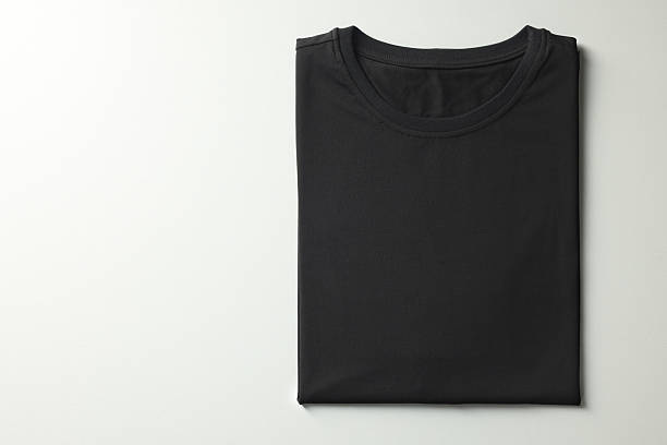 istock Blank black t-shirt on white background, top view. Mockup for design 2242661097