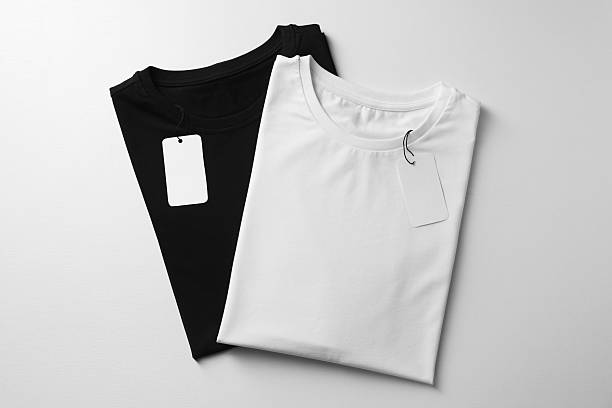 istock Different blank t-shirts on white background, top view. Mockup for design 2242661152