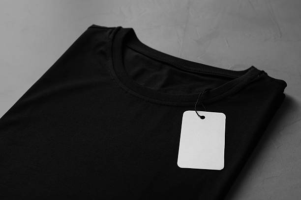 istock Blank black t-shirt on grey table, closeup. Mockup for design 2242661239