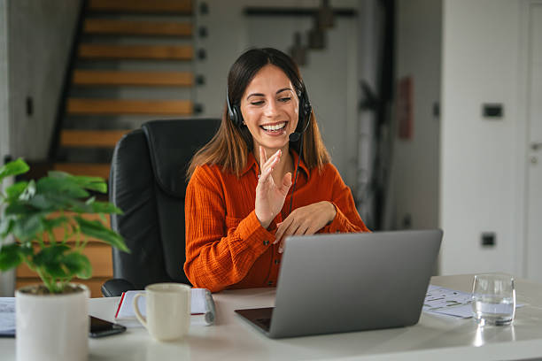 istock Young woman having video call meeting working remotely from home 2242663843