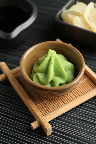 istock Hot wasabi paste, soy sauce and ginger on black textured table, closeup 2242663855