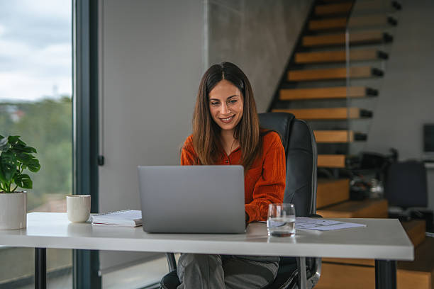 istock Professional woman working from home office using laptop 2242663898