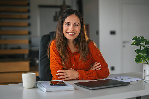 istock Young businesswoman smiling working from home office 2242663901