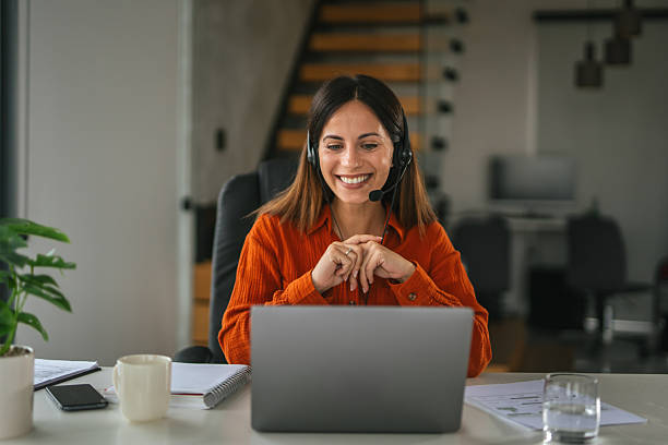 istock Woman in headset having video call for remote work 2242664076