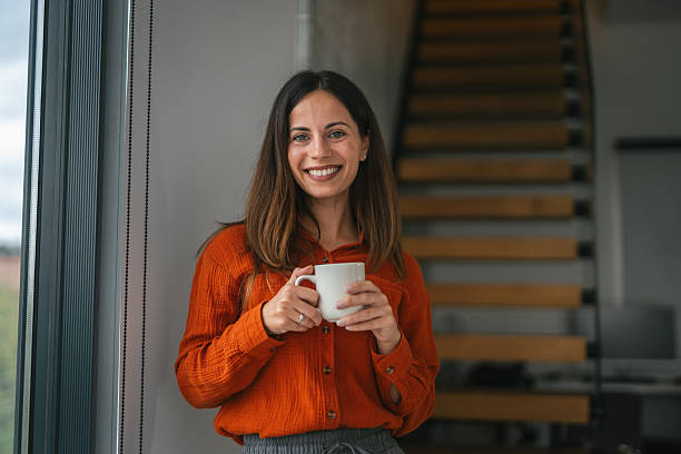 istock Woman enjoying a hot drink in morning cup 2242664200
