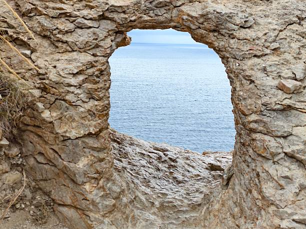 peaceful seaside scenery for relaxation, calm oceanic scene with rugged cliffs and horizon