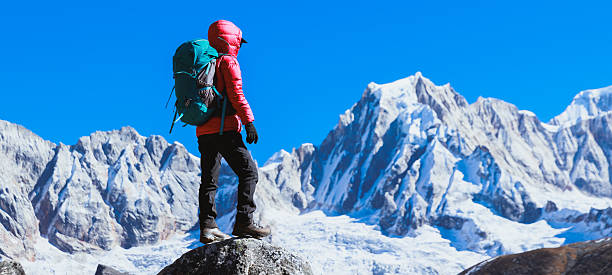 istock Successful woman hiker on high altitude mountain top 2242667290