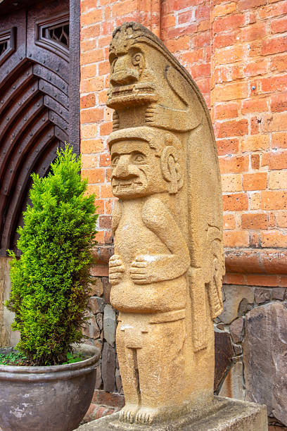 San Agustin (San Agustín), Huila, Colombia : close-up of a pre-columbian megalithic sculpture on display in the archaeological park. Impressive funeral megalithic statue carved with volcanic stone.