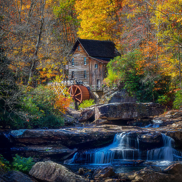 istock Autumn Watermill with Waterfall and Foliage 2242674388