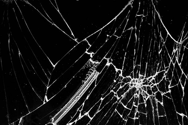 istock cracked glass isolated in black background 2242678934