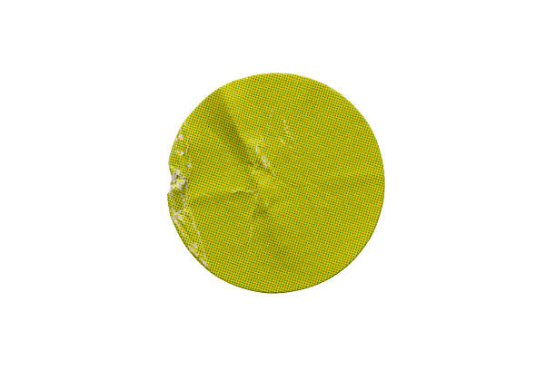 Blank green round adhesive paper sticker label isolated on white background