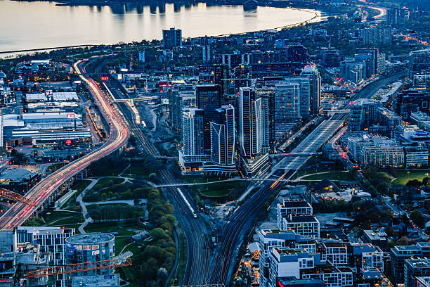 istock Aerial Evening Cityscape with Highway Light Trails and Waterfront 2242680566