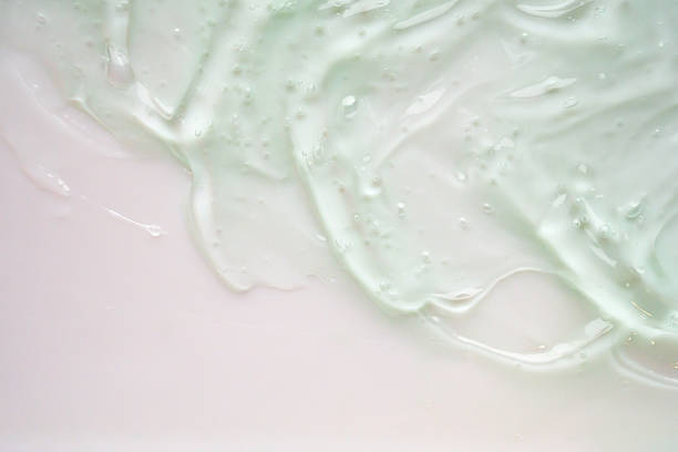 istock Transparent clear green liquid serum gel cosmetic texture background 2242686988