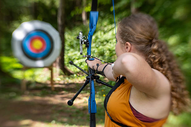 istock Teenage Archer in Forest Practicing Focused Archery Skills 2242687144