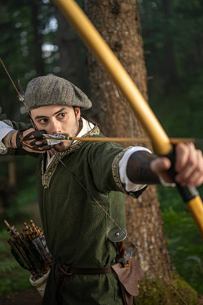 istock Young Caucasian Archery Enthusiast Practicing in Woodland Environment 2242687252