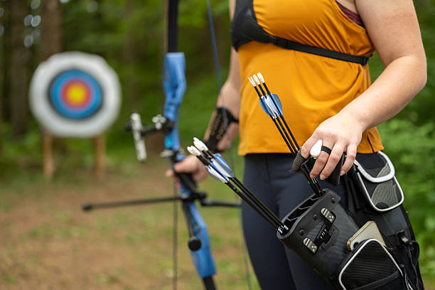 istock Young Caucasian Woman Preparing Archery Gear in Forest 2242687253