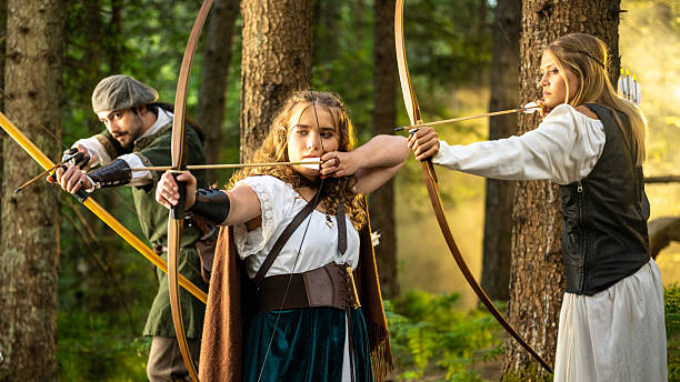 istock Young Caucasian Archers Practicing Traditional Skills in Forest 2242687279