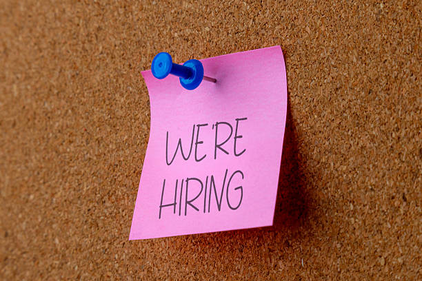 istock A note pinned to a corkboard displays the message WE'RE HIRING. 2242695598