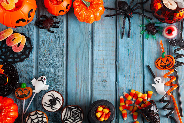 istock Halloween party decorations frame on blue wooden rustic table 2242695727