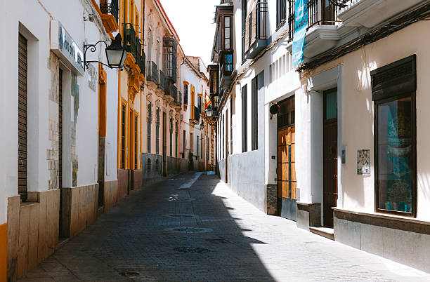 istock Cordoba alley with traditional Spanish architecture bathed in sunlight 2242698023