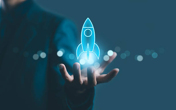 istock Businessman holding glowing rocket icon in hand, representing startup launch, innovation, growth, and futuristic technology concept for digital business development. 2242699998