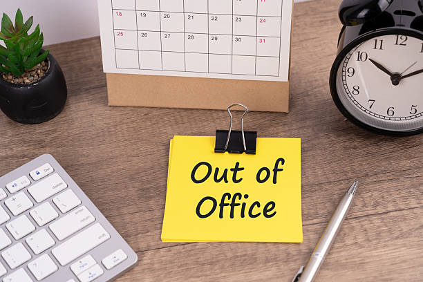 Out of office text on a paper note