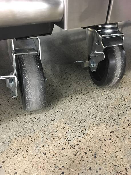 istock Caster Wheels on Industrial Freezers Sitting on a Concrete Floor 2242712309