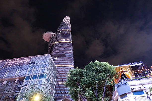 View from the ground of Bitexco Financial Tower at night. Top of the newly built and very modern Bitexco Financial Tower in Ho Chi Minh City, Vietnam. It was finished in 2010 and with a height of 265. 5 meters it is currently the highest building in Vietnam. Ho Chi Minh city, Vietnam. July 2025