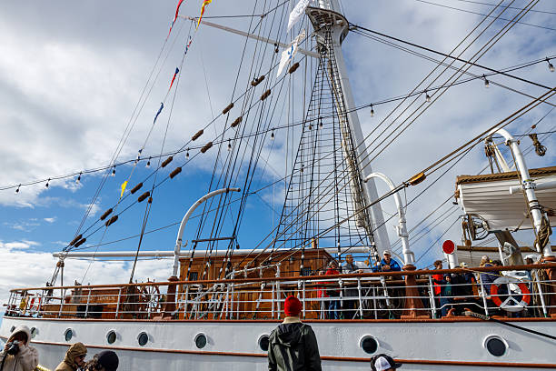 North Vancouver, Canada - Oct 19,2025: Norwegian tall ship Statsraad Lehmkuhl deck with visitors, crew, masts, rigging, railings and lifeboats
