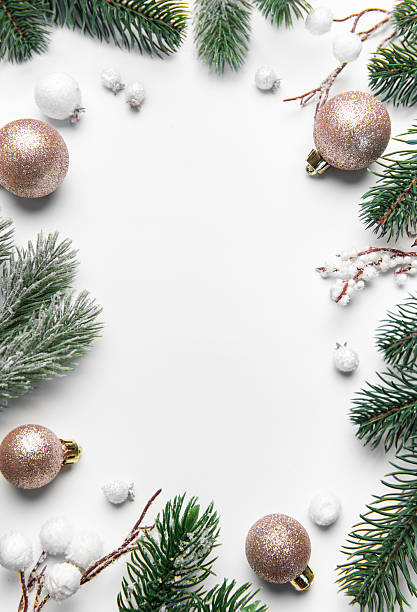 istock Christmas frame with pine branches and ornaments on white background 2242715411