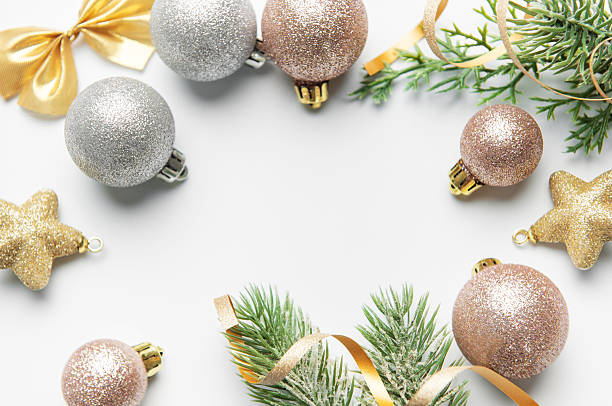 istock Christmas ornaments and pine branches framing blank space 2242715416