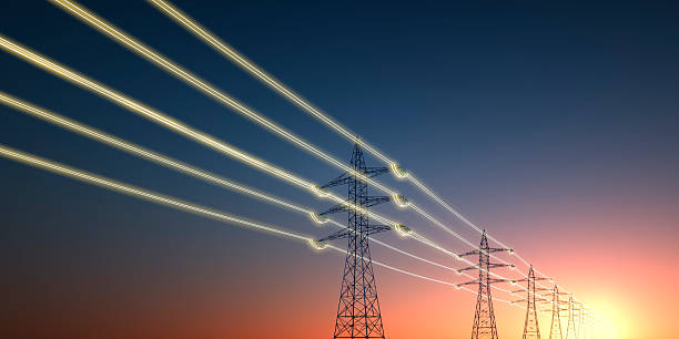istock Electricity transmission towers with glowing wires 2242718209
