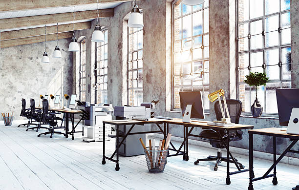 istock 3d rendering of a modern industrial loft office interior. Empty sunlit workspace with desks and chairs 2242719234