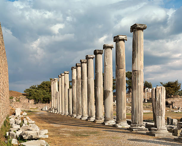 istock Row of ancient columns at Asklepion, Pergamon, Bergama, Turkey under a dramatic cloudy sky. 2242720805