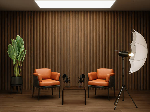 Modern Podcast Studio with Two Armchairs, Microphones, and Soft Lighting Setup
