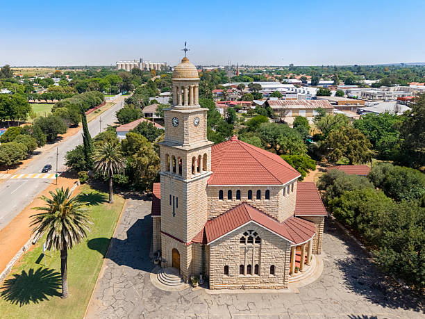 Wolmaransstad Dutch Reformed church. It is situated between Johannesburg and Kimberley and proclaimed as a town in 1891 on the farms known as Rooderand and Vlakfontein. It is a maize farming and alluvial diamond mining area. .
