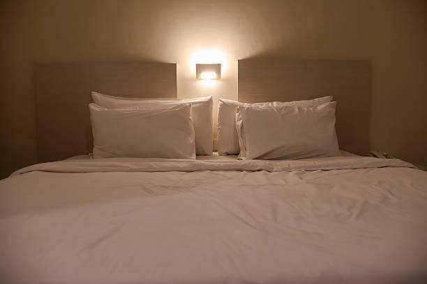 istock A comfortable, tidy hotel bed with crisp white linens 2242722945