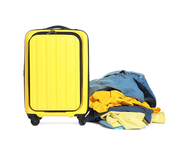 istock Suitcase and messy pile of clothes isolated on white 2242725266