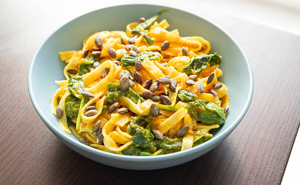 istock pumpkin pasta with spinach fall cozy dinner close up 2242728779