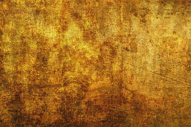 istock Distressed golden brown grunge texture with a rough, mottled surface resembling aged metal, oxidized copper, or antique parchment paper 2242730381