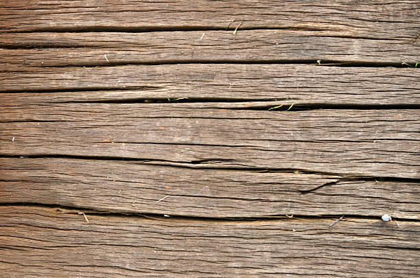 Wooden wall of beams of gray-brown color, texture 2019