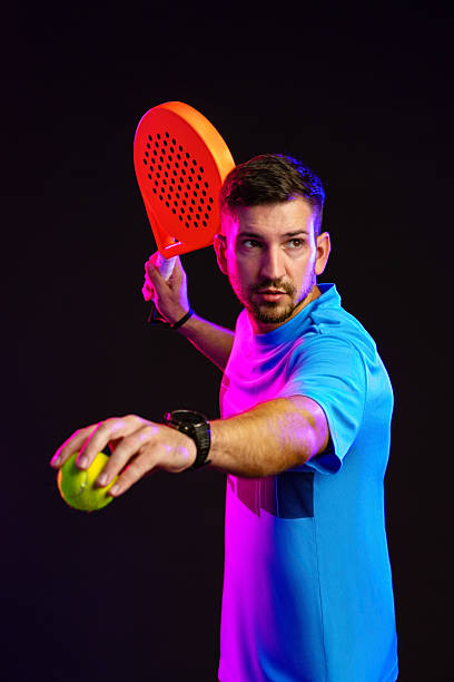 istock Player preparing to hit a ball with a paddle in a colorful indoor setting 2242738668