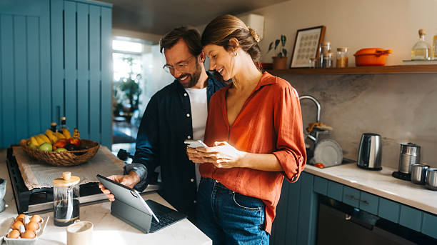 istock Couple cooking and working at home 2242748444