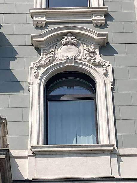 istock Elegant Stone Trimmed Windows from Historic Buildings – High-Resolution Architectural Photography 2242748908